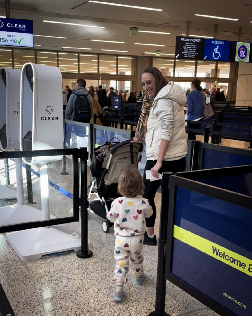 mom and daughter at clear checkpoint at airport