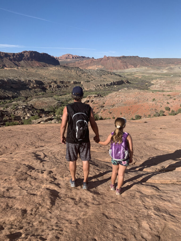 Dad and daughter in Arches national park