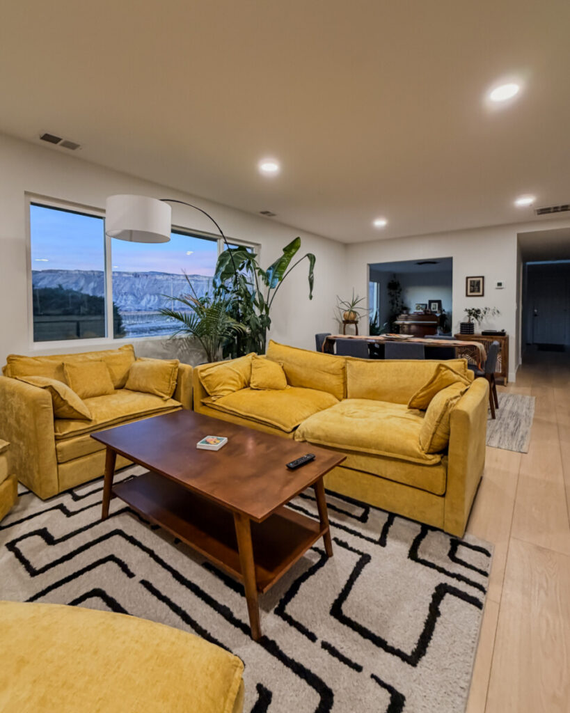 Open living room in a vacation rental for a large family group with two separate seating areas
