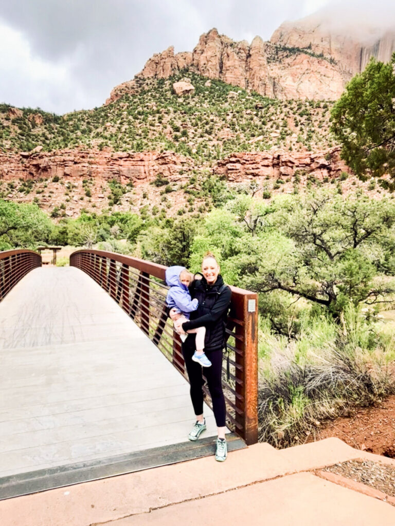 mother and daughter on trail in zion 