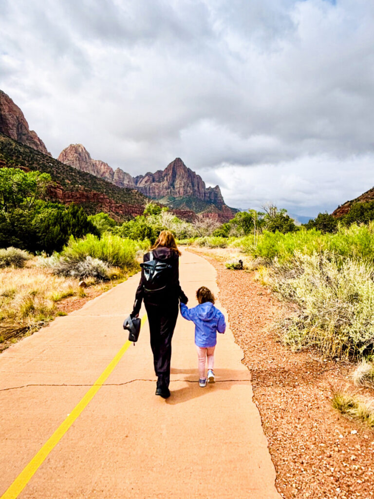 grandma walking with toddler on trail in zion 